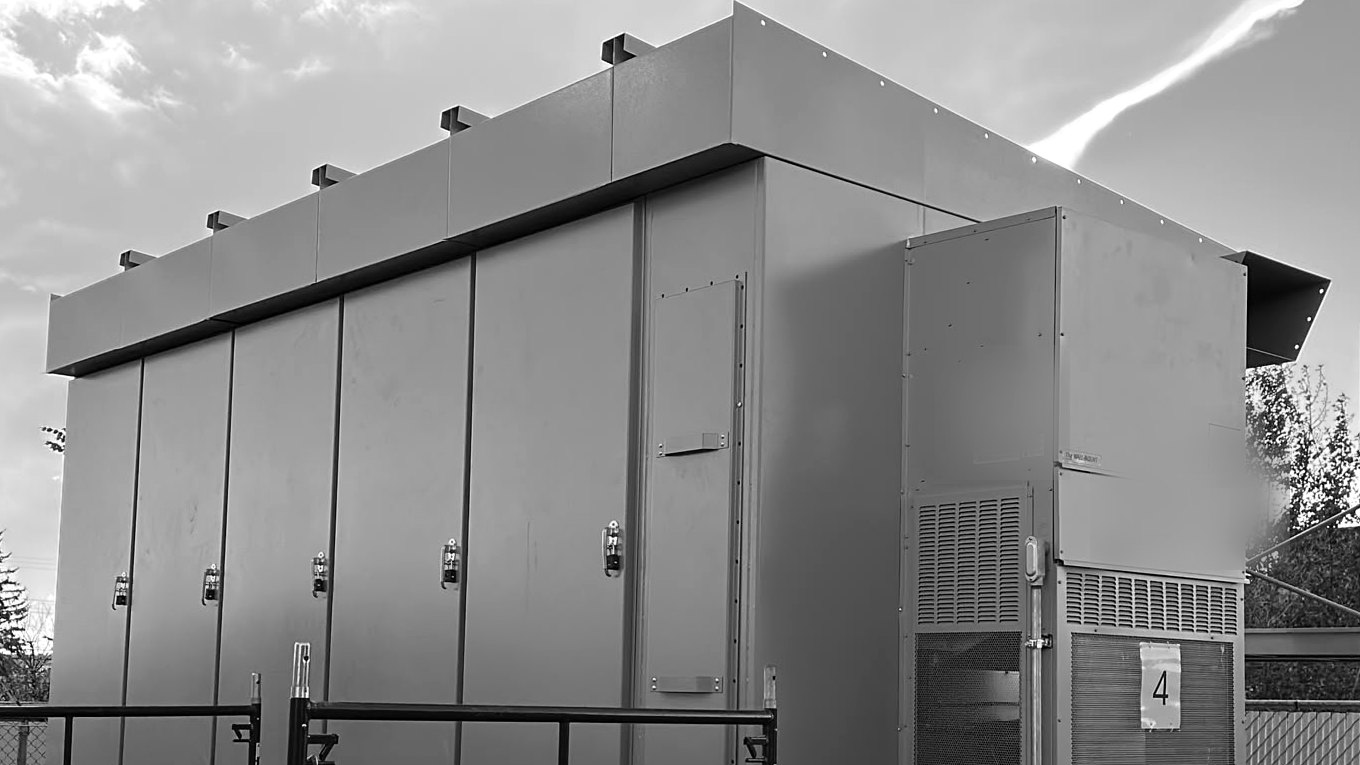 Numbered outdoor generator switchgear units staged together before shipment